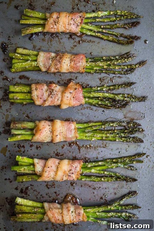 Grilled bacon-wrapped asparagus with visible char marks