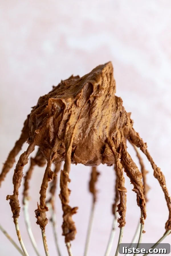 Silky Vegan Chocolate Dream Frosting 2 Silky chocolate vegan frosting on a whisk, ready to be spread