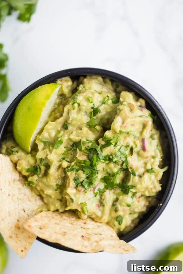 Freshly made homemade guacamole with tortilla chips