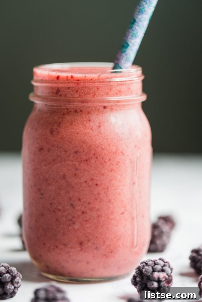 Vibrant blackberry kombucha smoothie in a glass