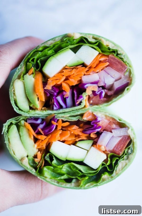 Assortment of loaded vegan veggie wraps, bursting with fresh ingredients