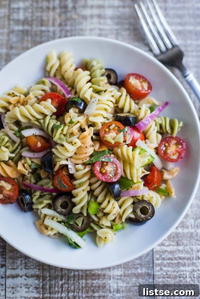 Flavorful and easy vegan pasta salad with fresh vegetables, perfect for summer potlucks