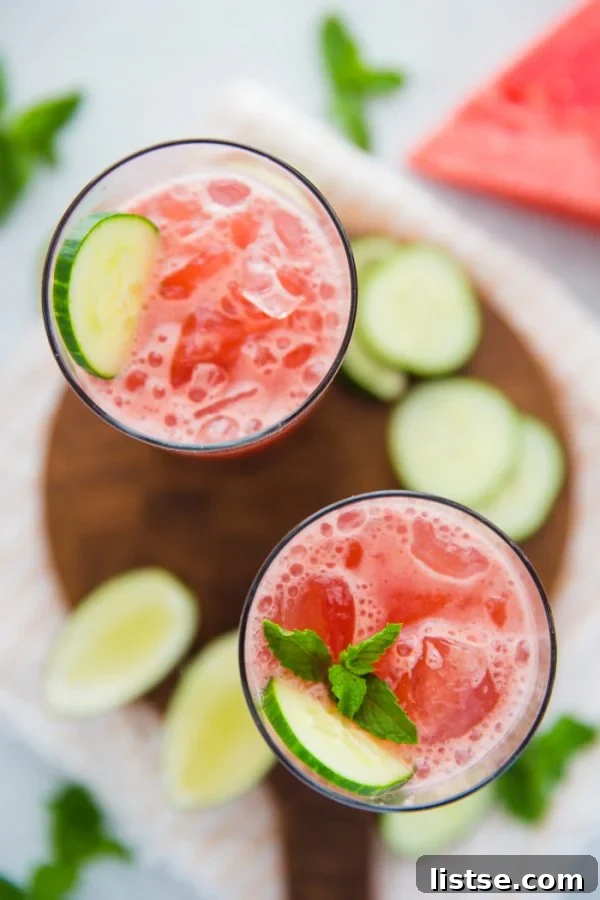 Refreshing watermelon cucumber juice in a glass, garnished with mint