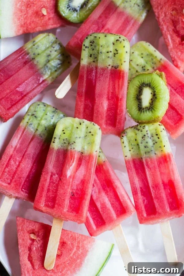 Colorful kiwi and watermelon fruit popsicles, a refreshing summer treat