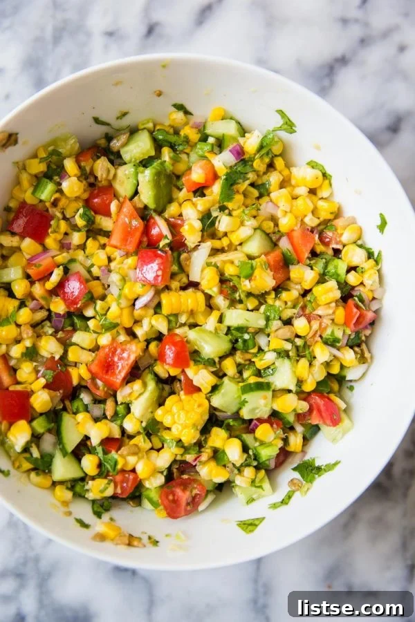 Vibrant grilled corn salad with fresh vegetables, perfect for any summer party