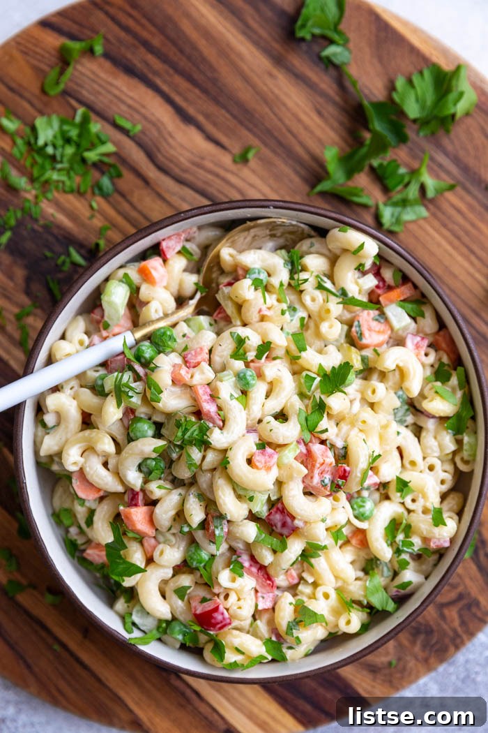 Creamy Plant-Based Macaroni Bliss 5 A classic-style vegan macaroni salad, showcasing its creamy texture and fresh ingredients.