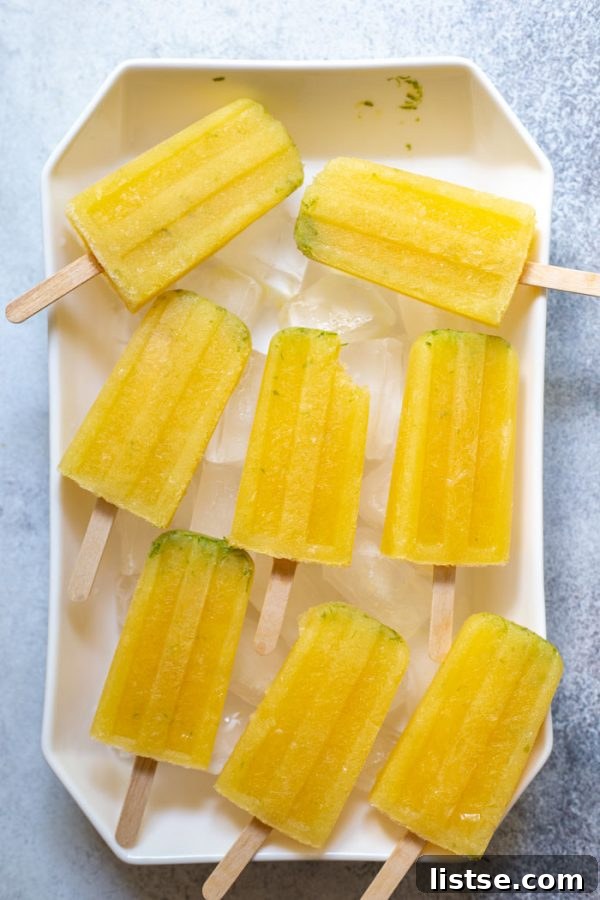 Close-up of frozen margarita popsicles with lime zest