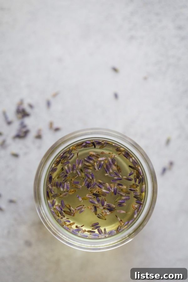 Homemade Simple Syrup 7 A bottle of Lavender Simple Syrup next to fresh lavender sprigs