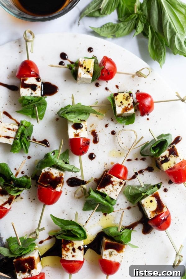 Fresh Tofu Caprese Skewers with cherry tomatoes, basil, and balsamic glaze