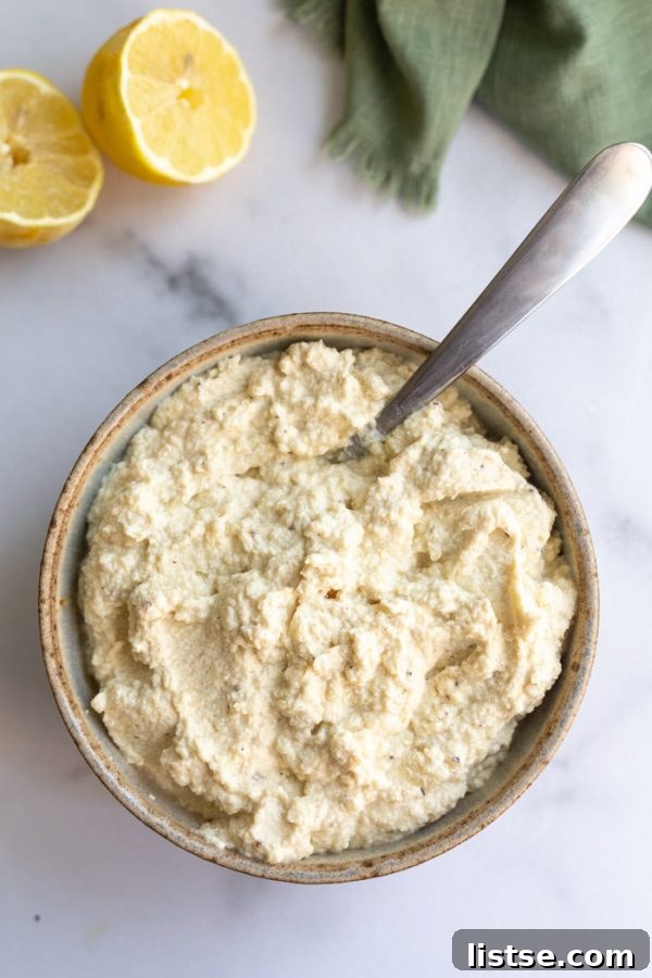 Serving of vegan ricotta cheese in a bowl, ready for cooking.