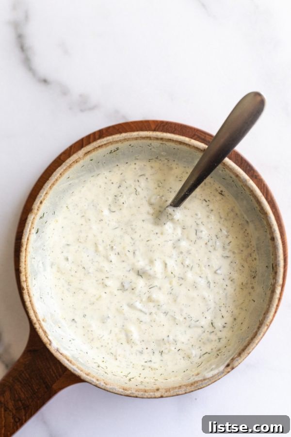 Zesty Vegan Tartar 4 Ingredients for vegan tartar sauce being mixed in a bowl, showing a creamy, chunky texture