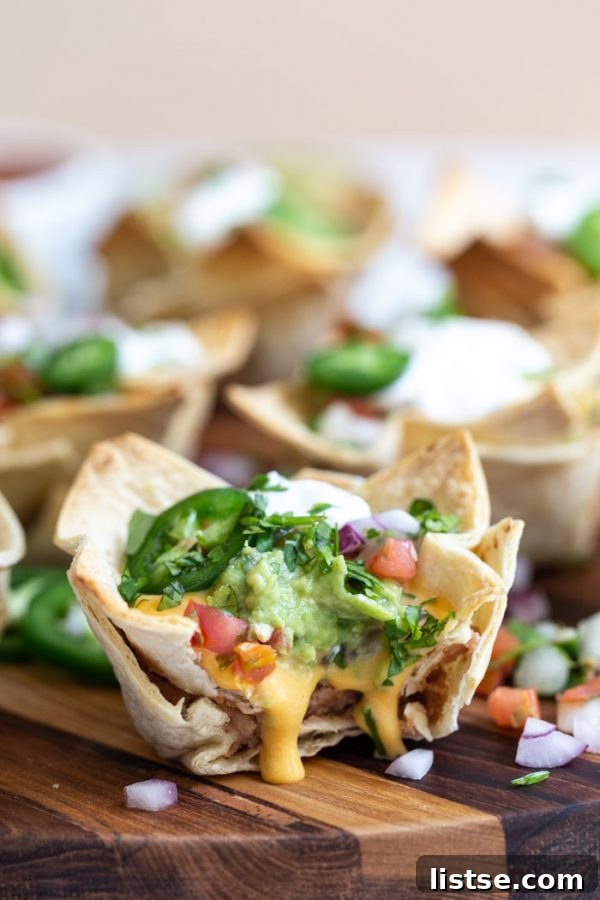 Close-up of crispy vegan taco cups filled with toppings