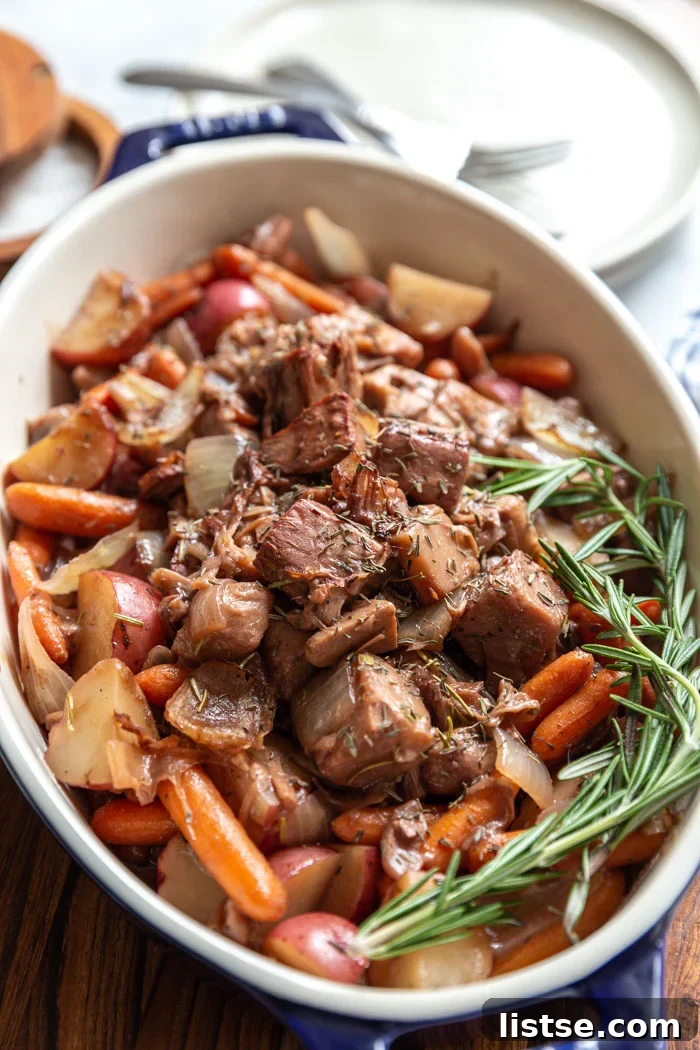 Savory Jackfruit Braise 4 Close-up of shredded jackfruit pot roast with herbs and gravy.