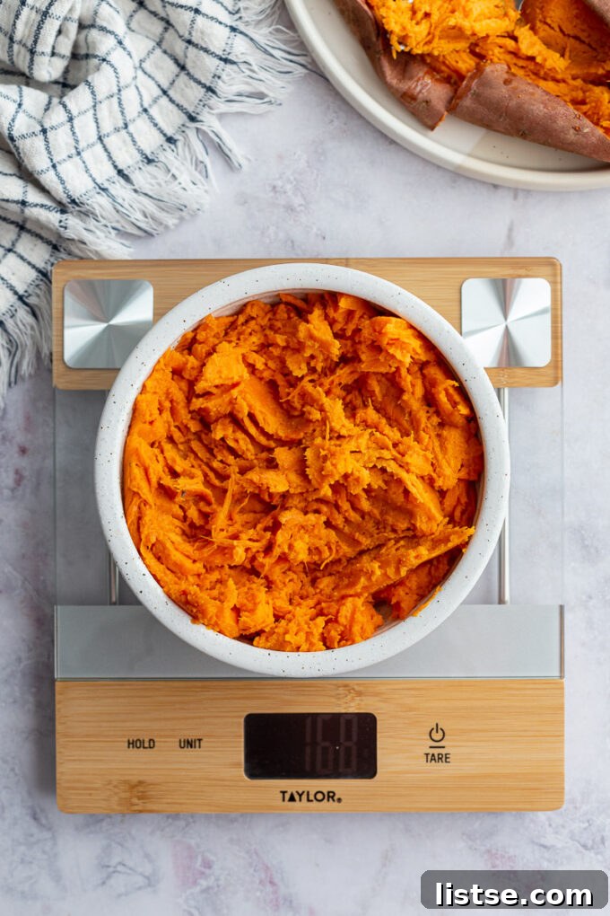 Golden Sweet Potato Heaven 4 kitchen scale with a bowl of mashed sweet potato on top