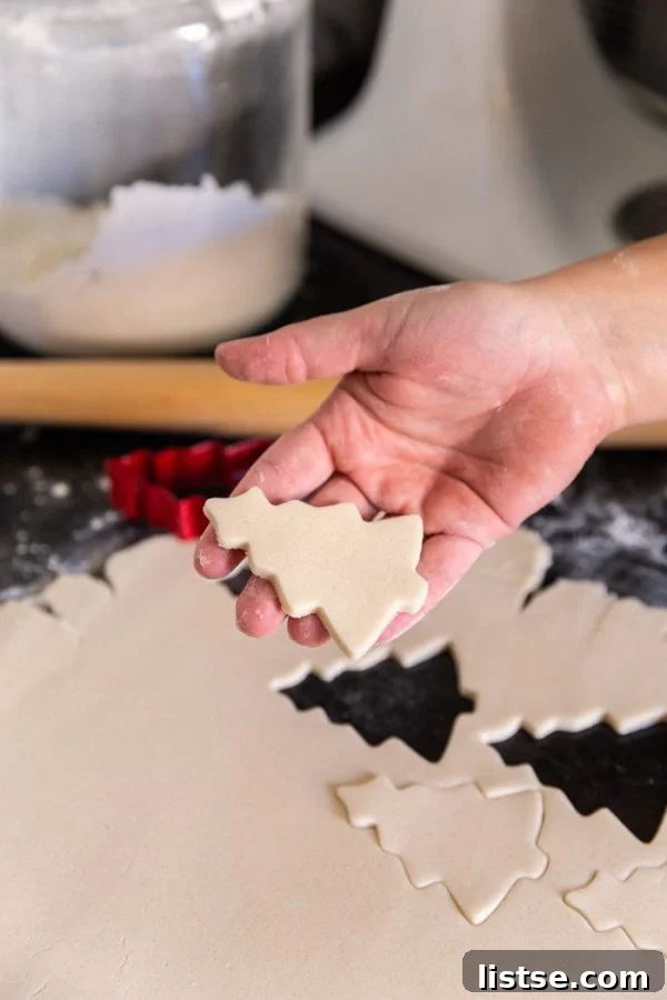 unbaked vegan cutout sugar cookies on a baking sheet