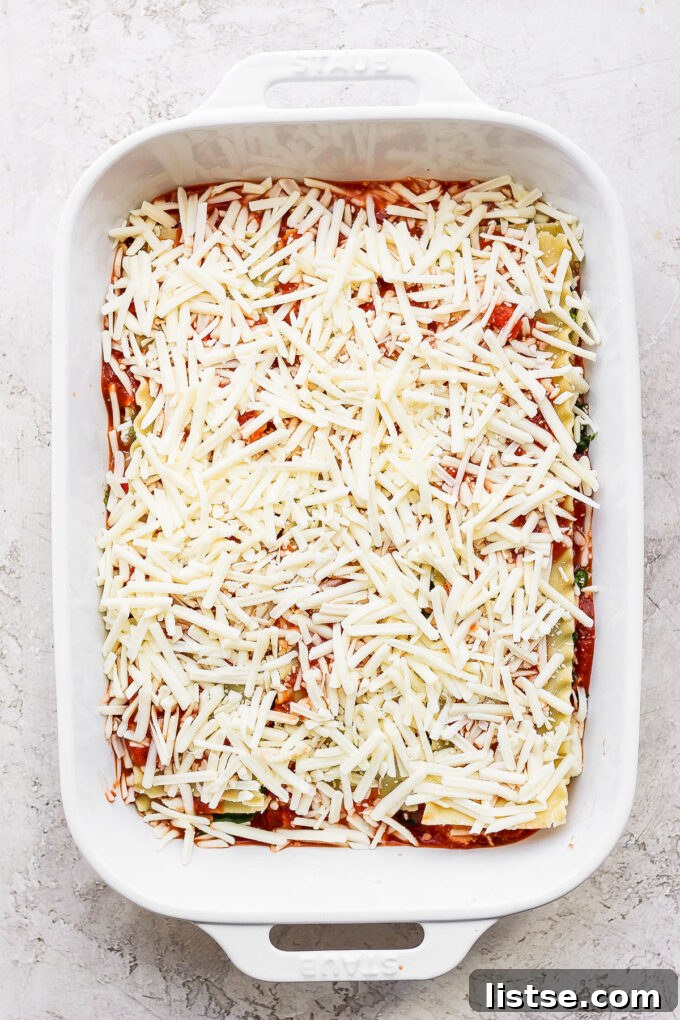 Ultimate Vegan Lasagna 6 Grated cheese over lasagna recipe.