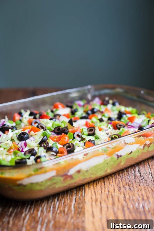 Impressive and delicious vegan 7 layer dip, a colorful and flavorful plant-based appetizer for parties and gatherings
