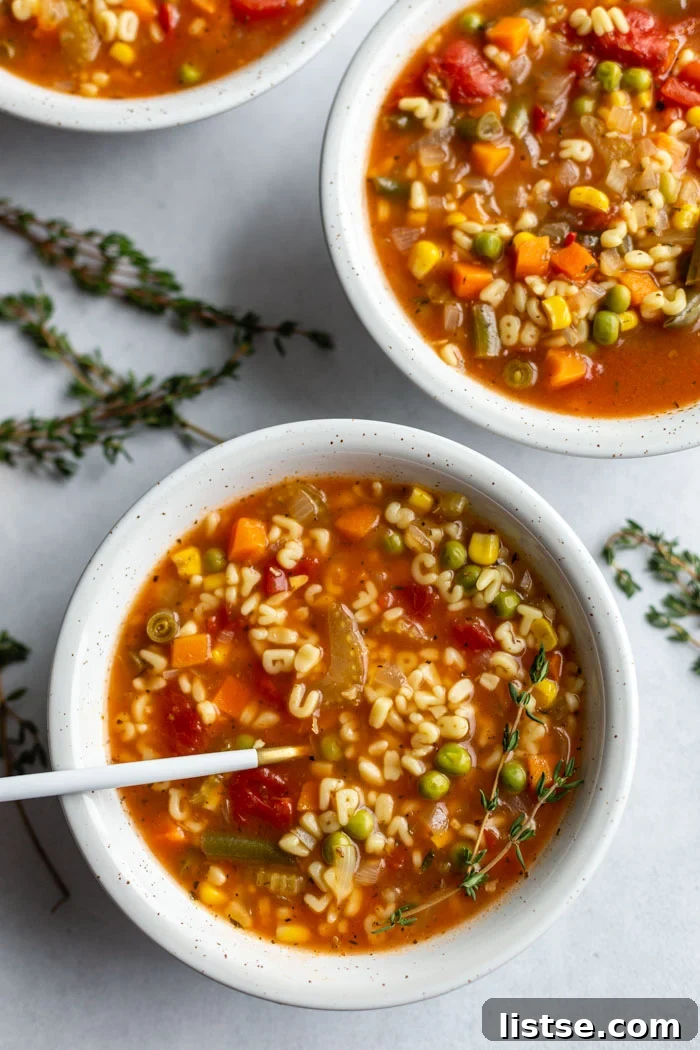 A-Z Delicious: Homemade Alphabet Soup 4 2 bowls of alphabet vegetable soup with a spoon on one bowl