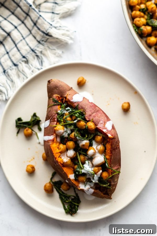 top down shot of a sweet potato stuffed with arugula and chickpeas