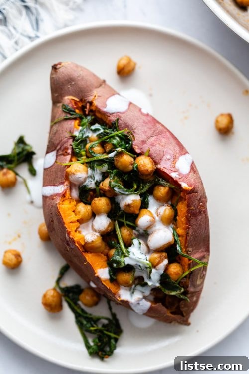 Chickpea stuffed sweet potato with green garnish