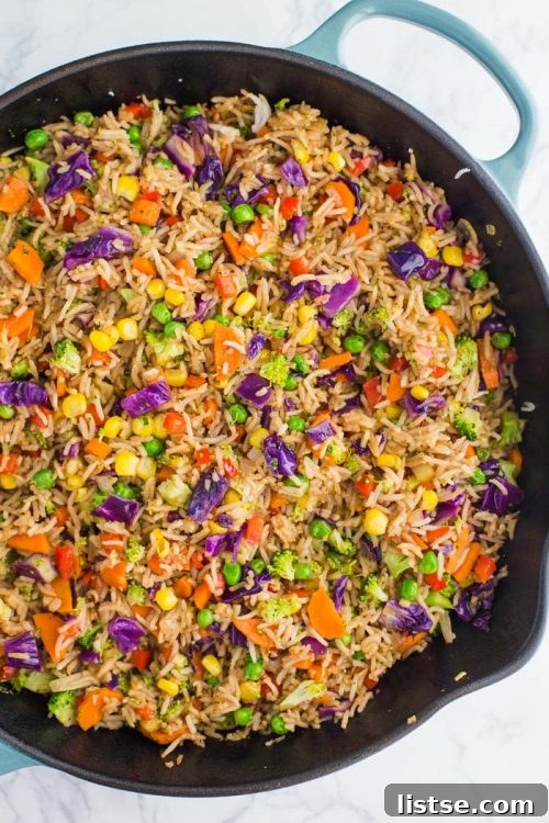 Skillet filled with loaded veggie fried rice