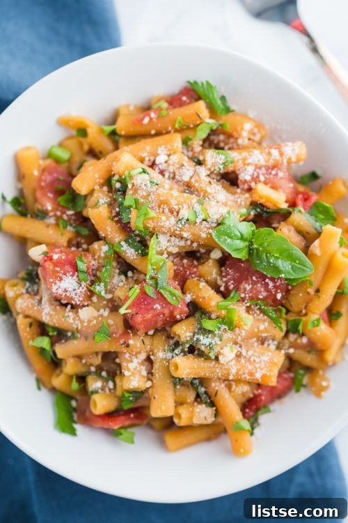 One-pot lentil pasta garnished with fresh herbs