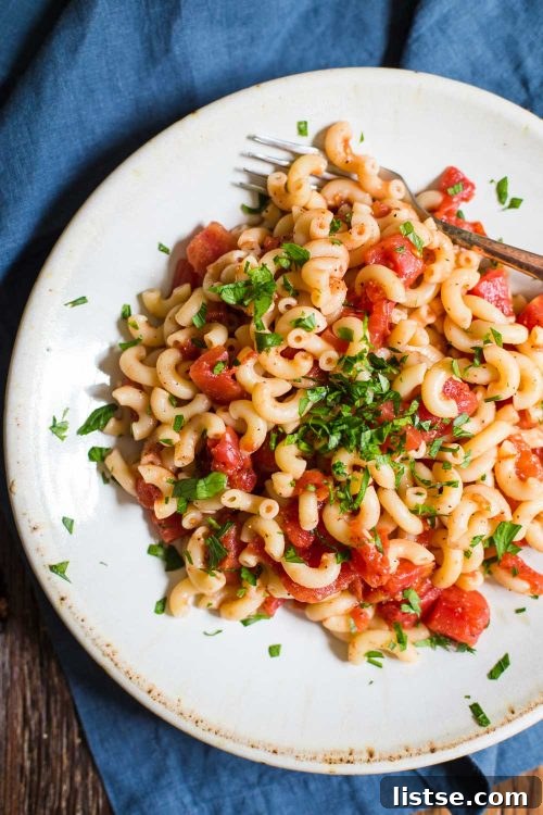 Simple tomato pasta with basil leaves