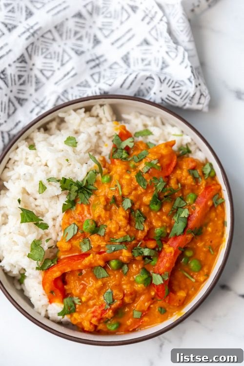 Coconut lentil curry served with a side of rice
