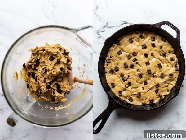 side by side shot: (left) top down shot on a marble board of a stand mixer glass bowl with chocolate chip cookie dough in it and a spatula out the side. (right) top down shot on a marble board of a black cast iron skillet filled with raw chocolate chunk cookie dough