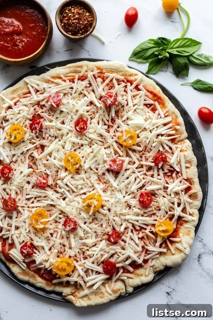 Smoky Plant-Based Grilled Pizza 6 Overhead shot of a beautifully grilled vegan pizza on a cutting board, ready to be served.