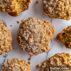Overhead view of Coffee Cake Banana Muffins with crumble topping and powdered sugar.