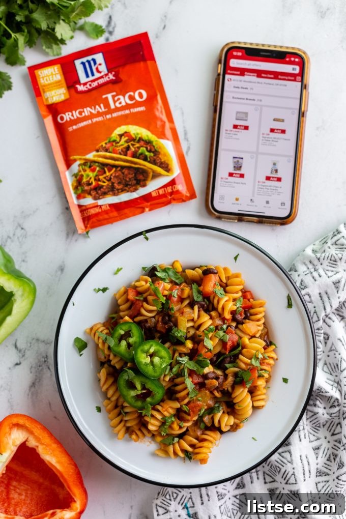 Close-up of a vibrant vegan one-pot taco pasta dish, ready to be served.