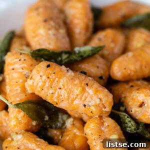 Sweet potato gnocchi in a sage sauce in a white bowl