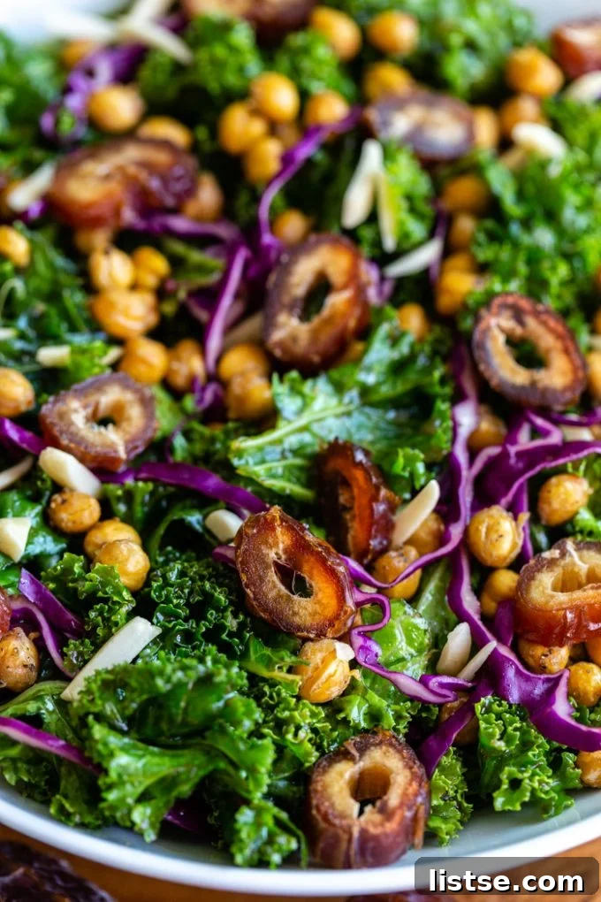 date kale salad with purple cabbage, chickpeas, and almonds