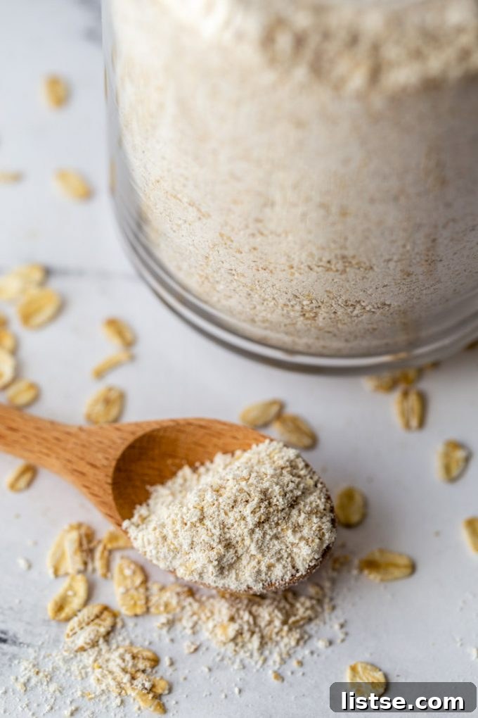 up close shot of oat flour on a wooden spoon