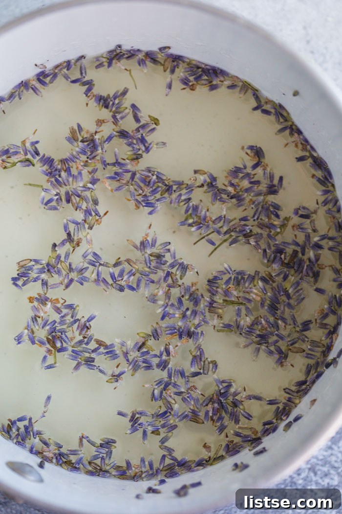 Sweet Serenity: Crafting Lavender Syrup 2 Fresh lavender flowers in a pot with water, ready to be transformed into aromatic lavender simple syrup.
