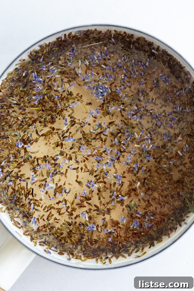 Sweet Serenity: Crafting Lavender Syrup 4 Dried lavender flowers steeping in a pot of water on the stove, infusing the simple syrup.