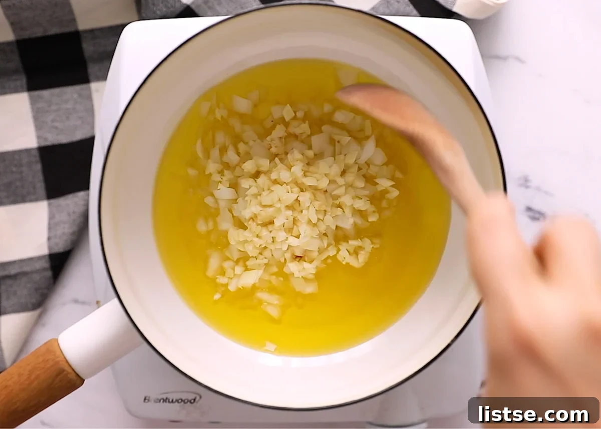 Effortless Vegan Gravy 5 step 1 in making vegan gravy - sauteeing onion and garlic in a pot of olive oil