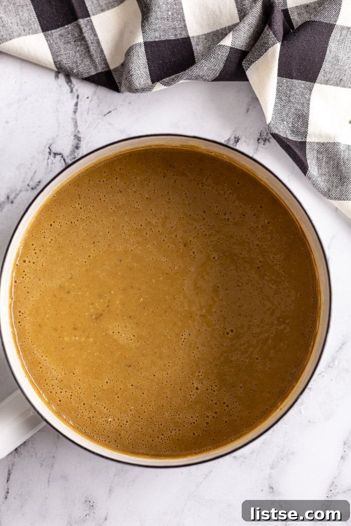 Effortless Vegan Gravy 9 white pot filled with brown vegan gravy