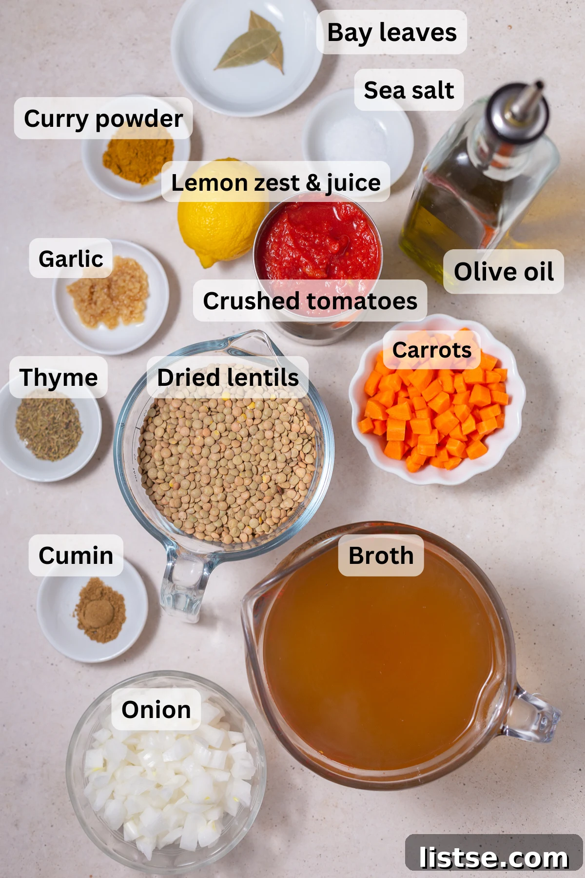 One-Pot Vegan Lentil Soup 4 ingredients laid out that are needed to make vegan lentil soup