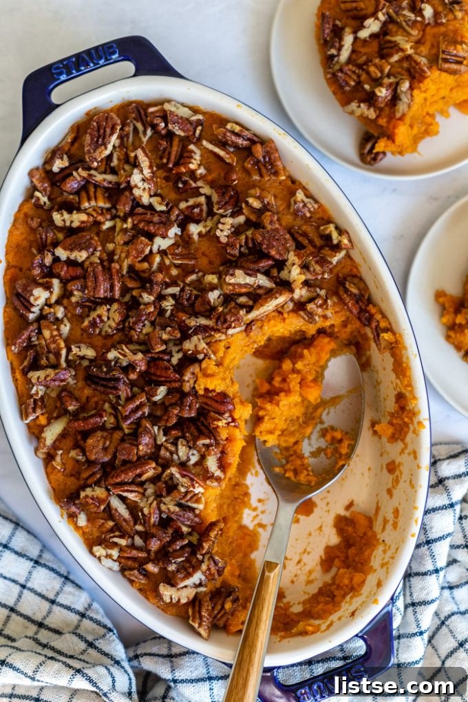 Wholesome Vegan Sweet Potato Bake 4 close-up top down view of vegan sweet potato casserole with a generous layer of candied pecans