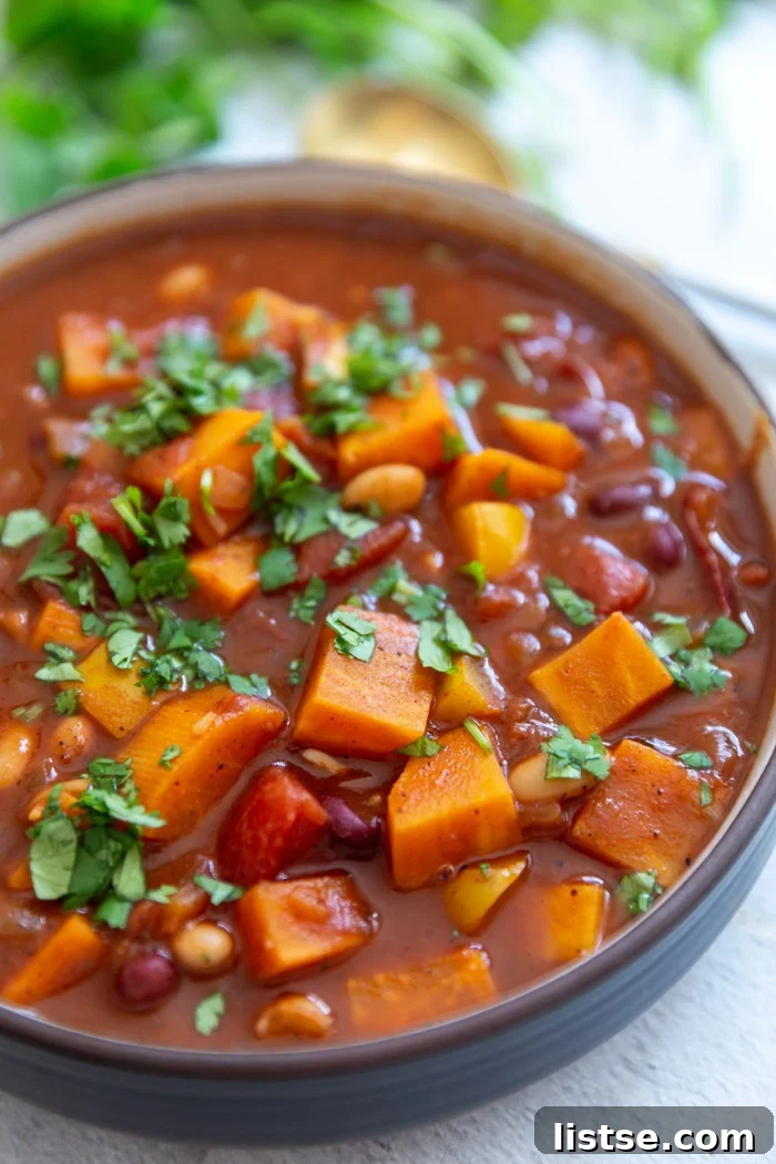 Hearty sweet potato chili served in a bowl, showcasing its rich texture and colorful ingredients.