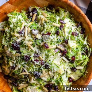 Brussel Sprout Salad topped with cranberries and almonds