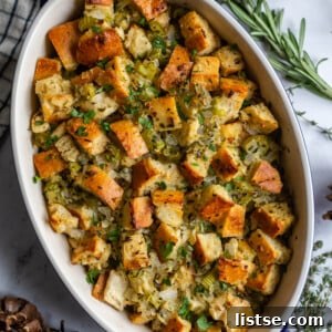 casserole dish filled with a simple vegan stuffing recipe topped with fresh herbs