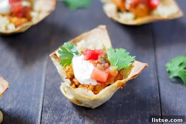 A close-up of a single golden-brown Taco Salad Cupcake
