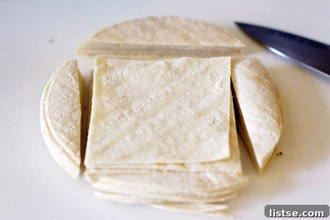 Corn tortillas cut into squares for taco cups
