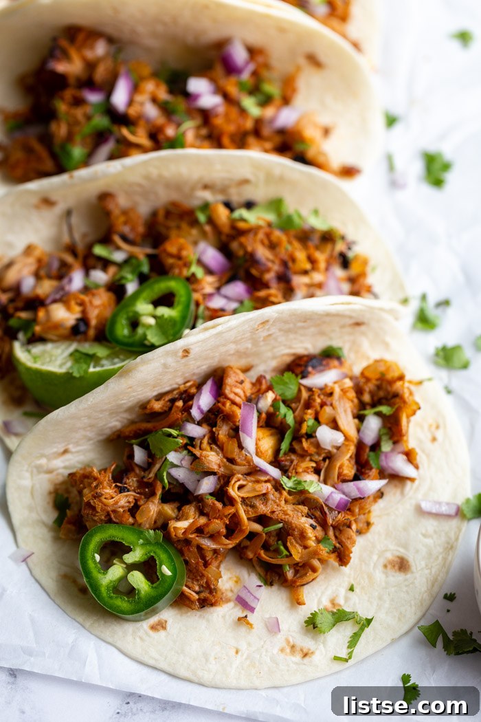 Pulled Jackfruit Carnitas 2 jackfruit carnitas tacos on flour tortillas and topped with onion, cilantro, and jalapeno