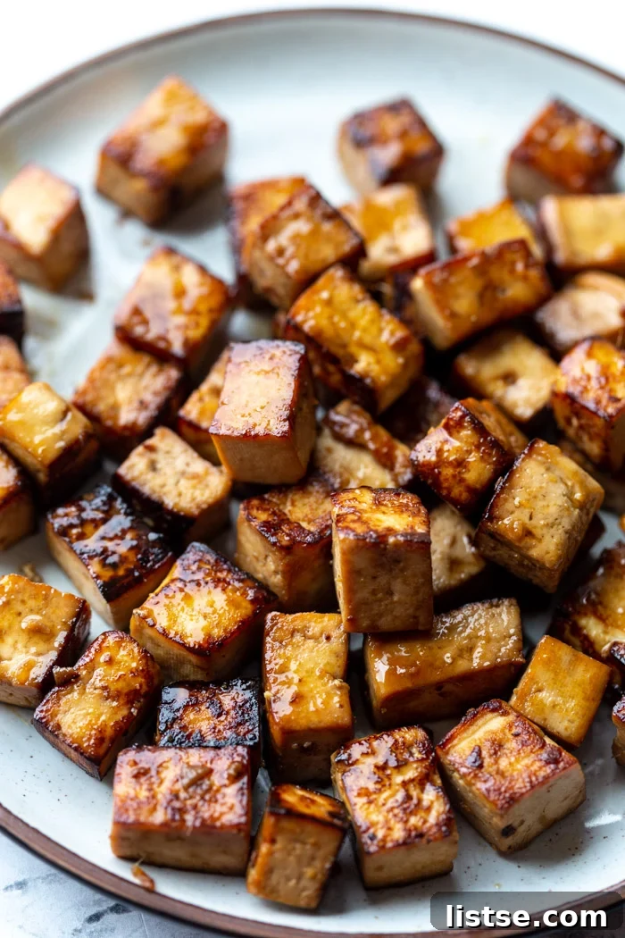 6 Effortless Tofu Marinade Ideas 8 marinated baked tofu on a plate