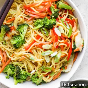 Vegetable chow mein in a large bowl, showcasing tender noodles and colorful stir-fried vegetables.