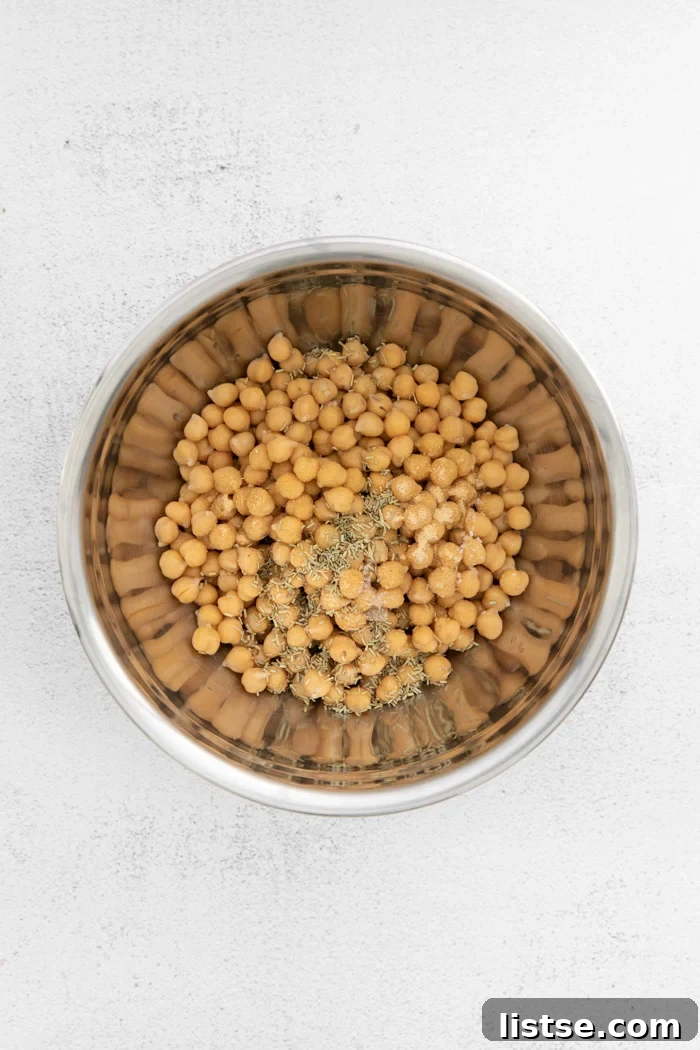 chickpeas in a metal bowl with spices